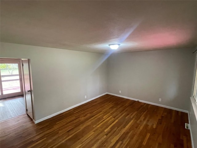 bonus room featuring dark hardwood / wood-style flooring