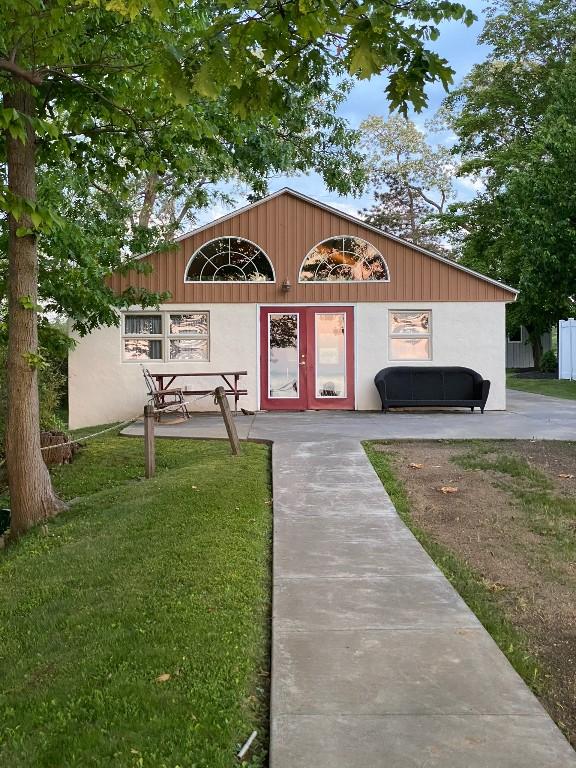 view of outbuilding featuring a yard