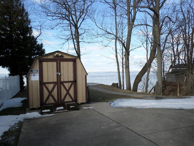 view of outbuilding with a water view