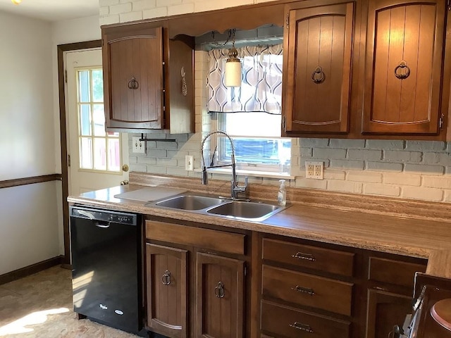 3322 Parade St, Erie, PA 16504 - kitchen with dishwasher, decorative backsplash, and light countertops