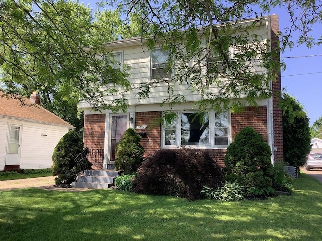 3322 Parade St, Erie, PA 16504 - colonial home with brick siding and a front yard
