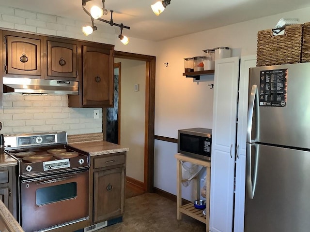 3322 Parade St, Erie, PA 16504 - kitchen featuring appliances with stainless steel finishes, under cabinet range hood, decorative backsplash, open shelves, and light countertops