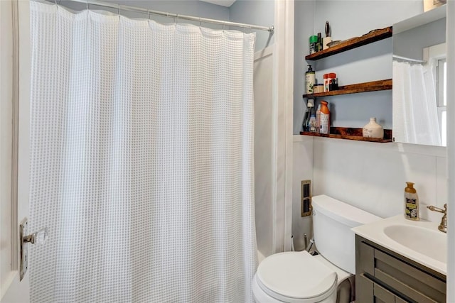 bathroom featuring vanity, a shower with curtain, and toilet