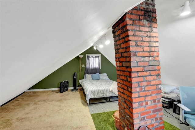 carpeted bedroom featuring lofted ceiling