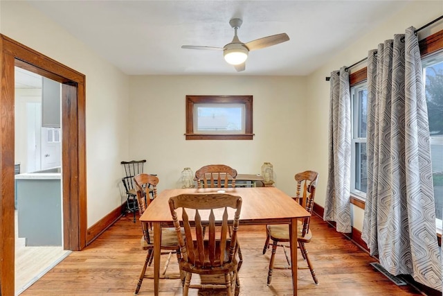 dining space featuring ceiling fan and light hardwood / wood-style floors