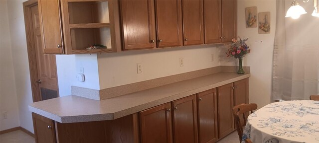 21 Ridgewood Dr, Erie, PA 16426 - kitchen with brown cabinets, light countertops, and open shelves