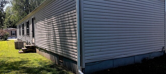 21 Ridgewood Dr, Erie, PA 16426 - view of property exterior featuring a central AC unit and a yard