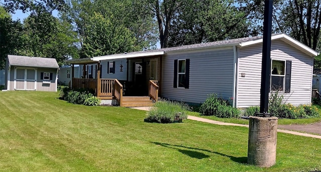 21 Ridgewood Dr, Erie, PA 16426 - manufactured / mobile home featuring a front lawn and an outdoor structure