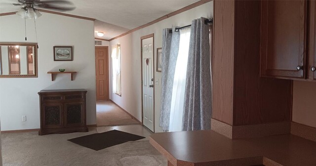 21 Ridgewood Dr, Erie, PA 16426 - foyer with ceiling fan, ornamental molding, and light colored carpet