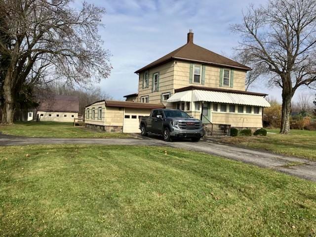 view of property exterior with a lawn and a garage