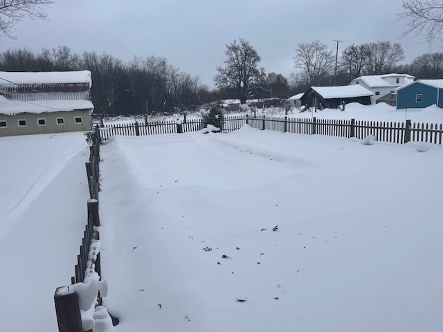 view of yard covered in snow