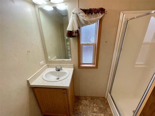 bathroom featuring vanity and walk in shower