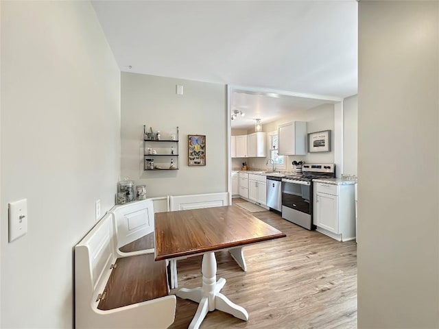 dining room featuring light wood finished floors