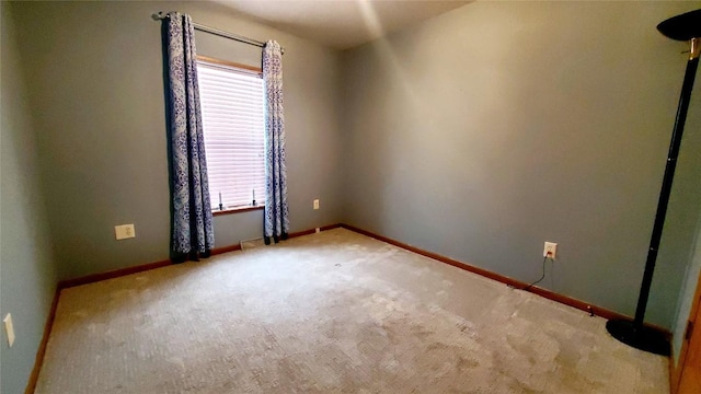 carpeted empty room featuring plenty of natural light