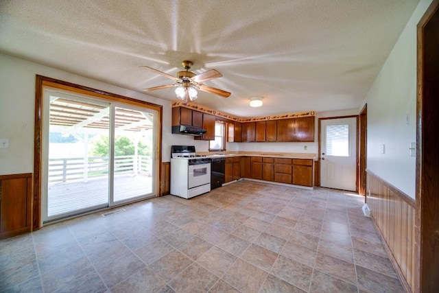 11379 Eureka Rd, Edinboro, PA 16412 - kitchen featuring white range with gas cooktop, under cabinet range hood, dishwasher, healthy amount of natural light, and a textured ceiling