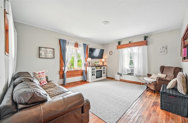 406 Spring St, Jamestown, PA 16134 - living room featuring healthy amount of natural light, hardwood / wood-style flooring, crown molding, and baseboards