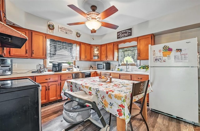406 Spring St, Jamestown, PA 16134 - kitchen with freestanding refrigerator, stainless steel microwave, light countertops, a sink, and stove