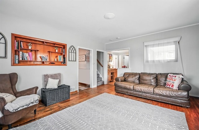 406 Spring St, Jamestown, PA 16134 - living area with wood finished floors, stairway, baseboards, and ornamental molding