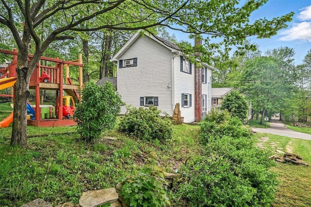 406 Spring St, Jamestown, PA 16134 - view of side of property with a chimney and a playground