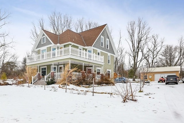 view of front of property with a garage and an outdoor structure