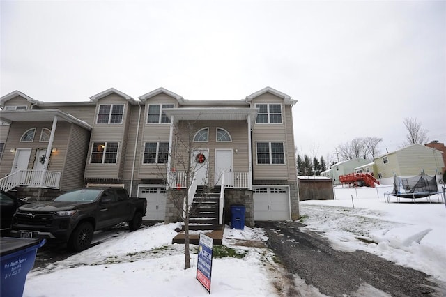 view of front of home with a trampoline