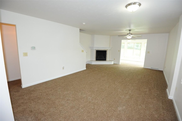 4140 Wood Hills Dr Unit C44, Erie, PA 16510 - unfurnished living room featuring carpet floors, a fireplace with raised hearth, ceiling fan, and baseboards