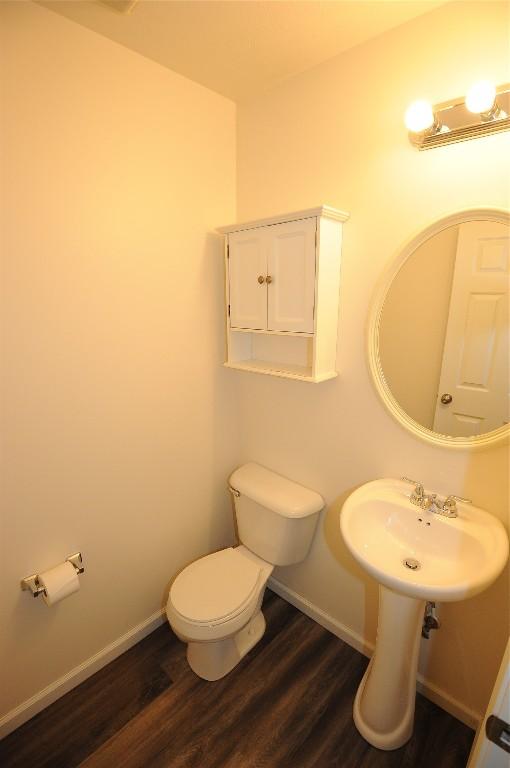 4140 Wood Hills Dr Unit C44, Erie, PA 16510 - bathroom featuring wood finished floors, baseboards, and toilet