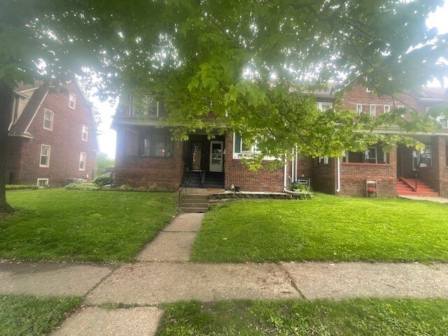 719 Smithson Ave, Lawrence Park, PA 16511 - obstructed view of property with brick siding and a front yard