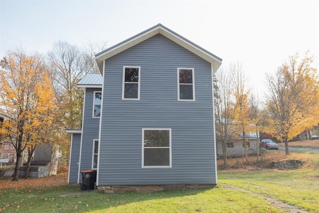 view of home's exterior featuring a yard