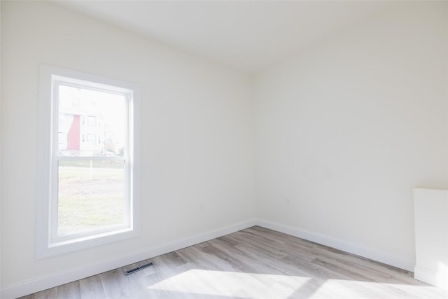 unfurnished room featuring light hardwood / wood-style flooring