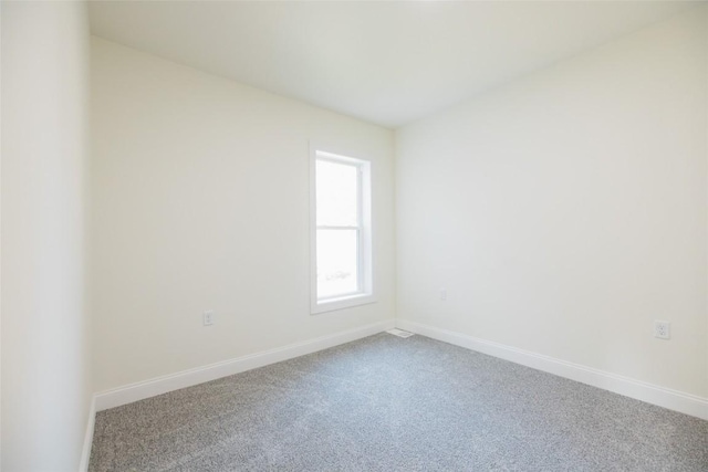 empty room with carpet flooring