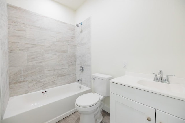 full bathroom with vanity, toilet, and tiled shower / bath combo