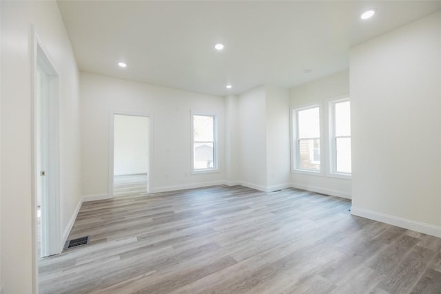 unfurnished room featuring light hardwood / wood-style floors