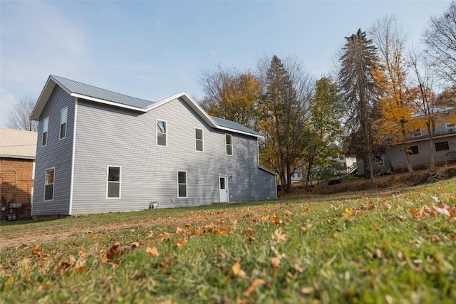 view of property exterior featuring a yard