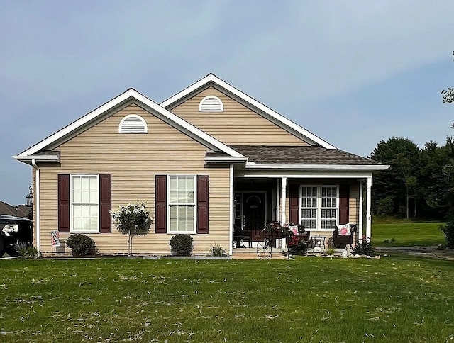 exterior space featuring a porch and a yard