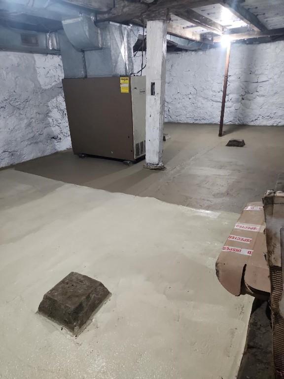 basement featuring heating unit