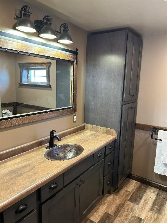 bathroom featuring vanity and hardwood / wood-style flooring