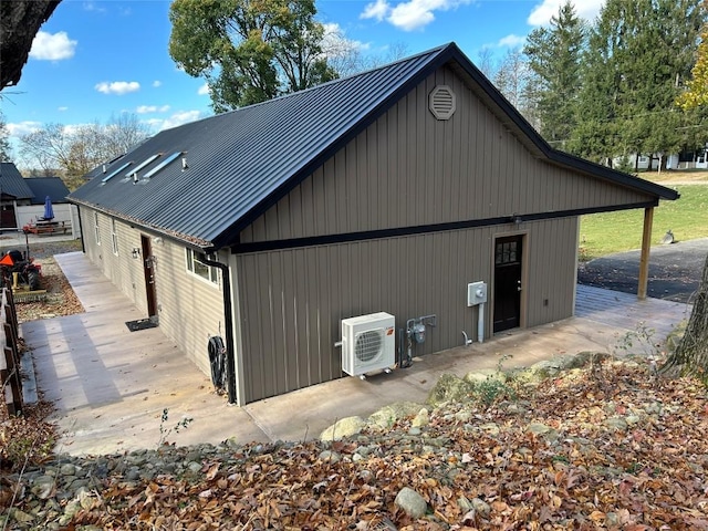 view of side of property featuring ac unit