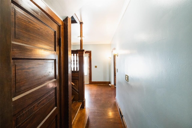 hallway with dark hardwood / wood-style flooring