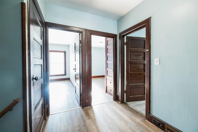 corridor featuring light hardwood / wood-style floors