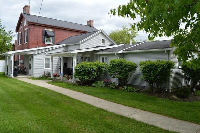 402 Main St, Saegertown, PA 16433 - back of property with a chimney and a lawn