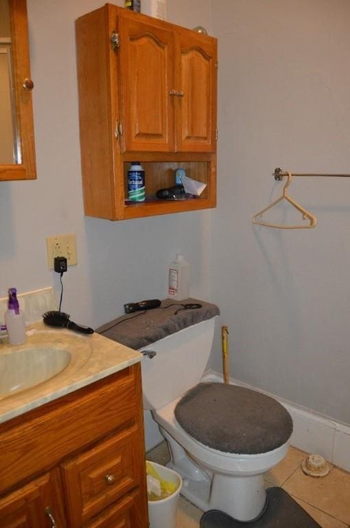 402 Main St, Saegertown, PA 16433 - half bath with vanity, toilet, and tile patterned floors