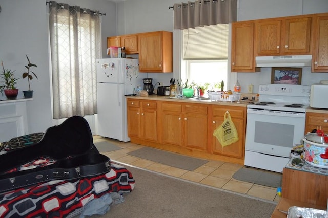402 Main St, Saegertown, PA 16433 - kitchen with white appliances, under cabinet range hood, light tile patterned flooring, and light countertops