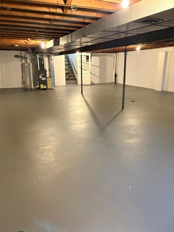 3322 Patio Dr, Millcreek, PA 16506 - unfinished below grade area with stairway and water heater