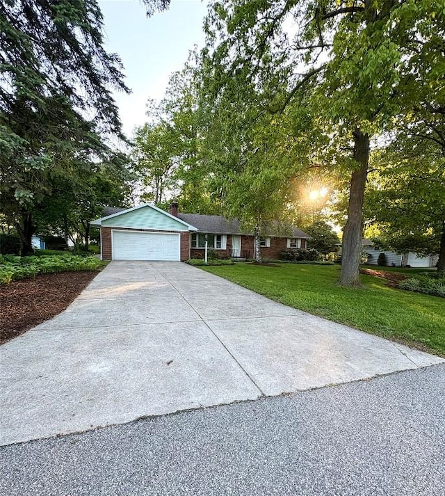 3322 Patio Dr, Millcreek, PA 16506 - ranch-style home featuring a front lawn, a garage, and a chimney