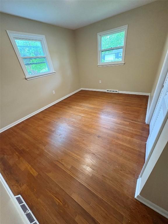 3322 Patio Dr, Millcreek, PA 16506 - unfurnished room featuring wood finished floors and baseboards