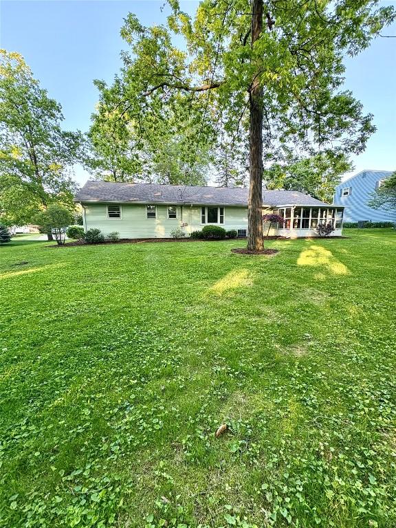 3322 Patio Dr, Millcreek, PA 16506 - rear view of house featuring a lawn