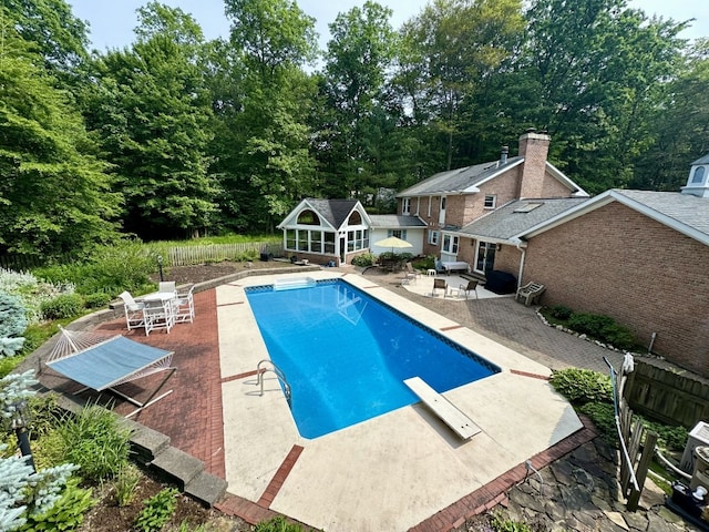 99 N Forest Ave, Meadville, PA 16335 - outdoor pool featuring a patio, a storage structure, an outdoor structure, and a diving board