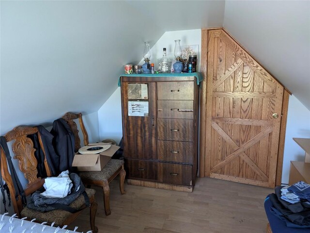 15916 Airport Rd, Linesville, PA 16424 - sitting room featuring wood finished floors, vaulted ceiling, and a dry bar