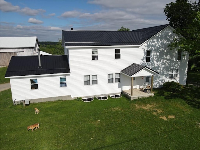 15916 Airport Rd, Linesville, PA 16424 - back of house with a yard and metal roof